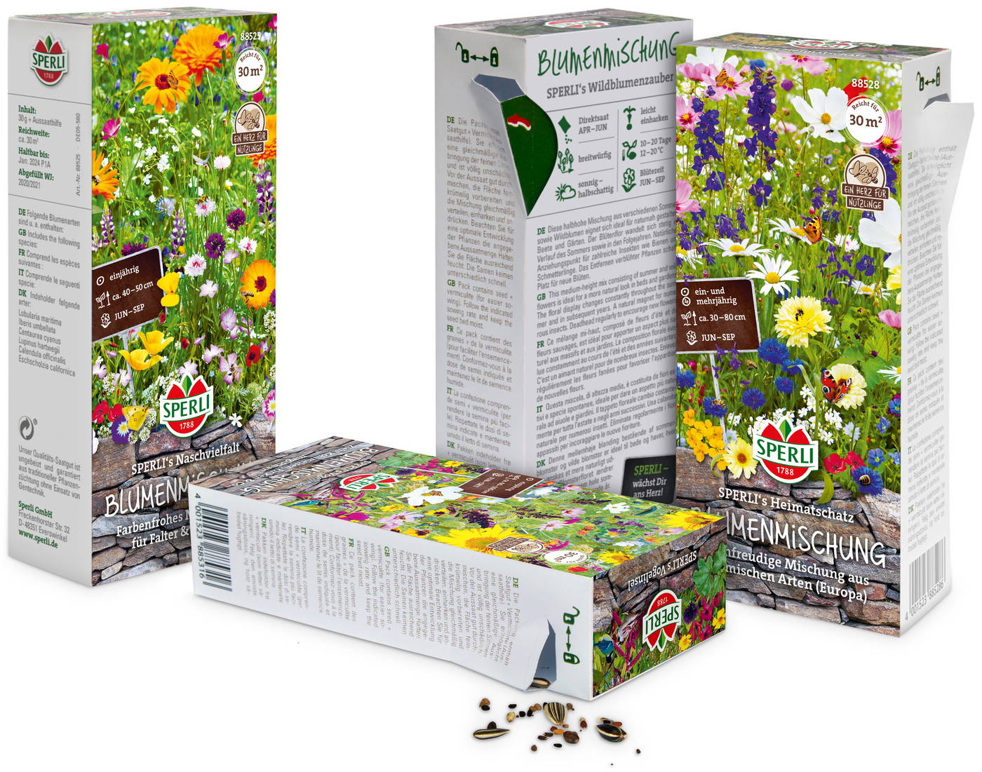 Vier Blumenmischungspackungen mit bunten Blumen, eine offene Samenpackung mit Samen.